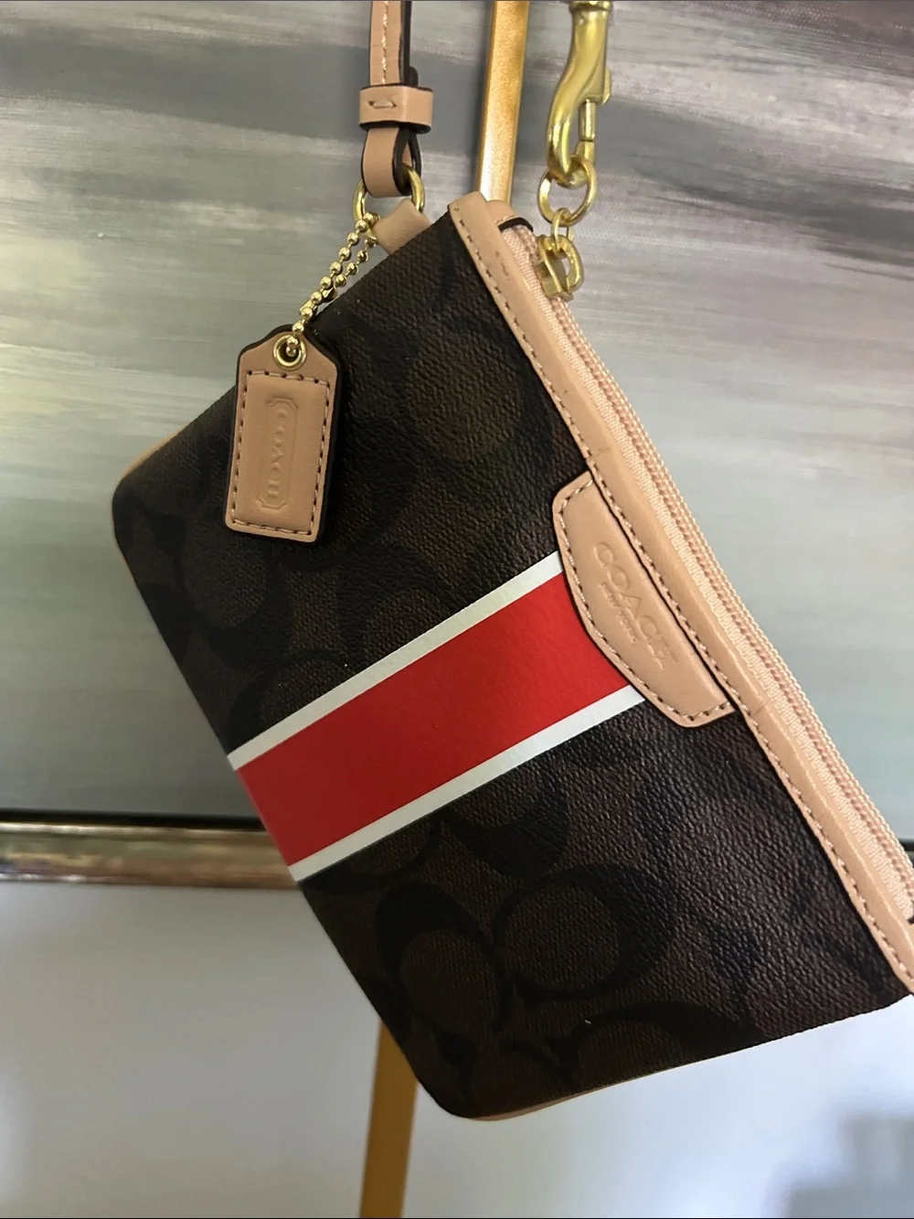 Coach Brown Signature Stripe Wristlet with Orange and White Accent Hang Tag